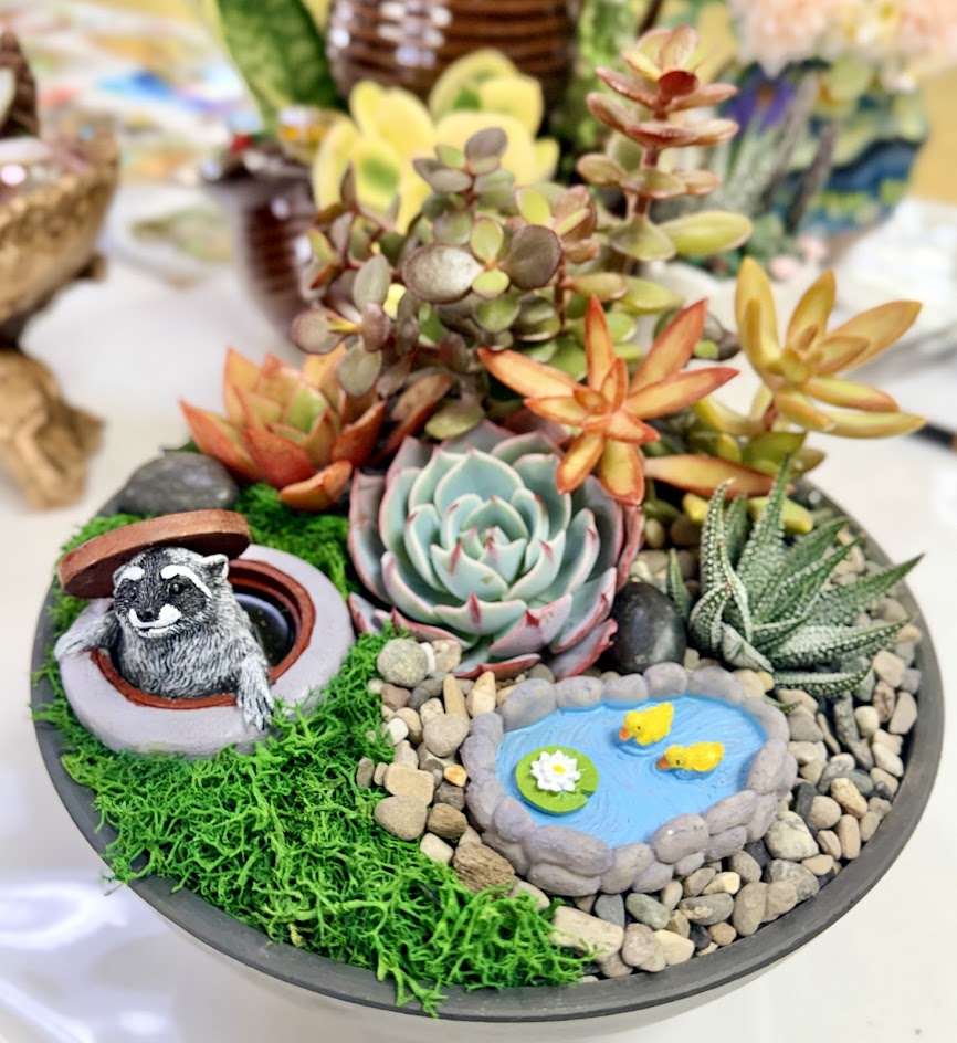 Raccoon in a Manhole Plant Decoration